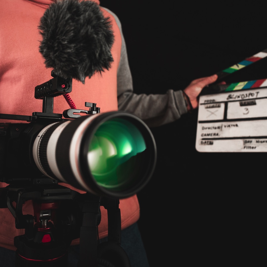 A professional video camera and clapperboard. High Quality Professional Video Production Edmonton, Calgary, Alberta, Canada